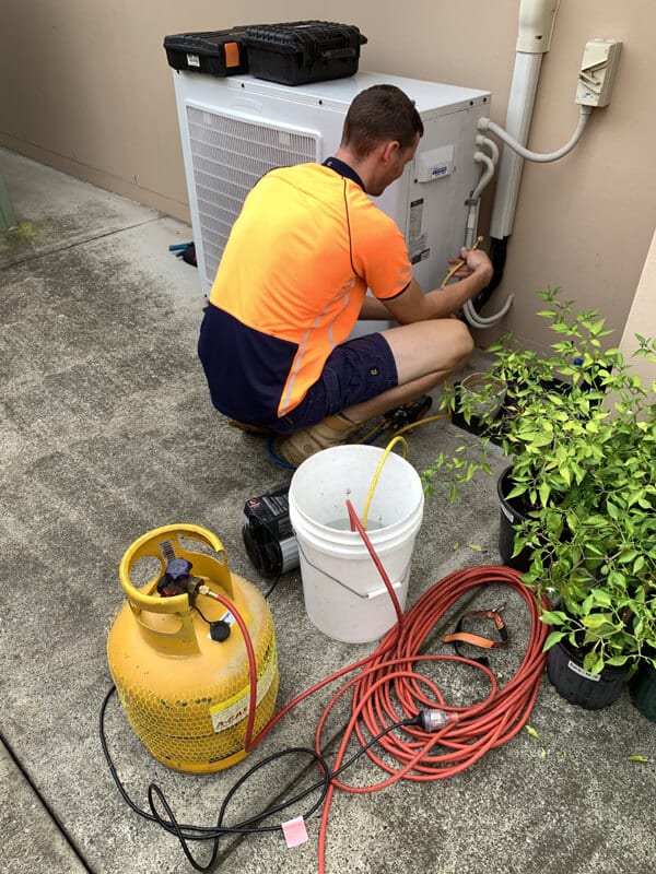 Removing the old refrigerant for recycling